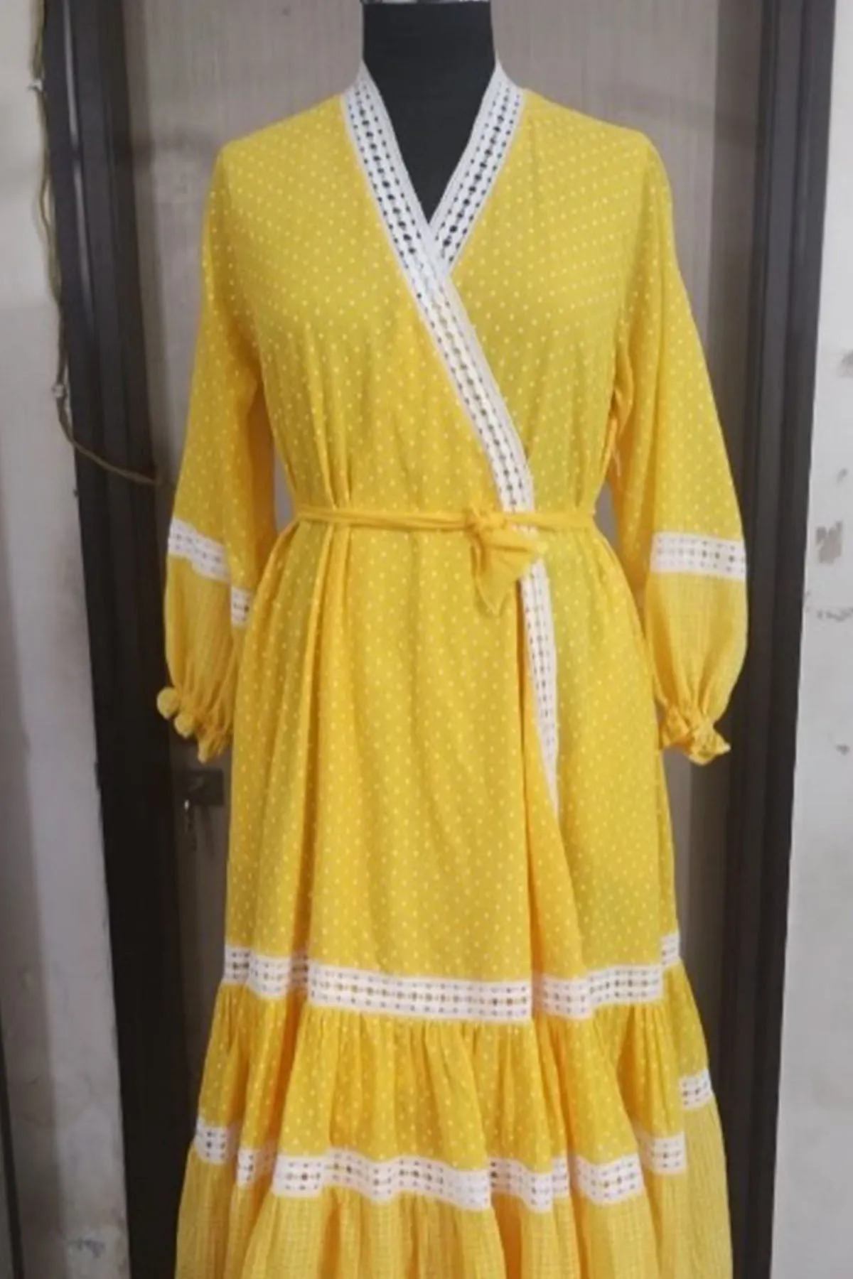 Yellow cotton polka dot printed tiered wrap around dress with lace details